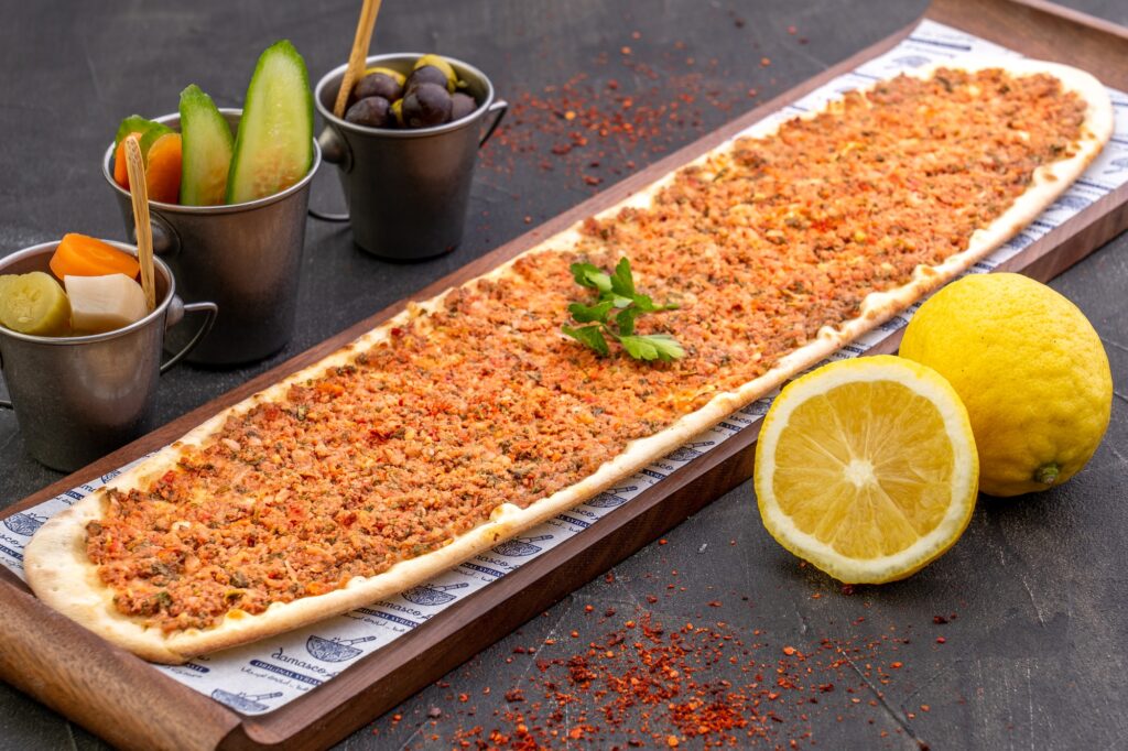 Closeup shot of TRADITIONAL SYRIAN food, meat with bread and lemon